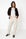 offwhite barreljeans lagos in combinatie met wit t-shirt en bruin jasje